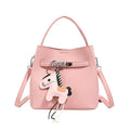 Women’s mini crossbody bag with playful design and cute charm