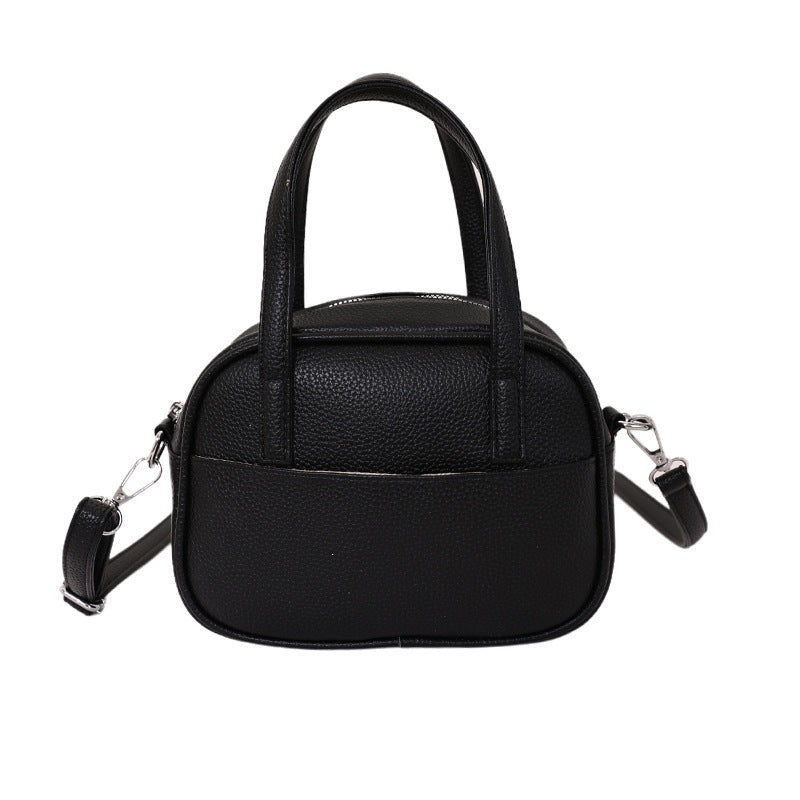 Women's mini handbag with playful animal charm