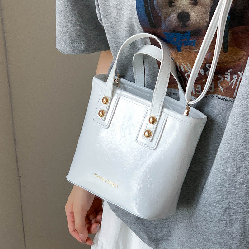 Women's mini bag with elegant structure and practical carrying handle