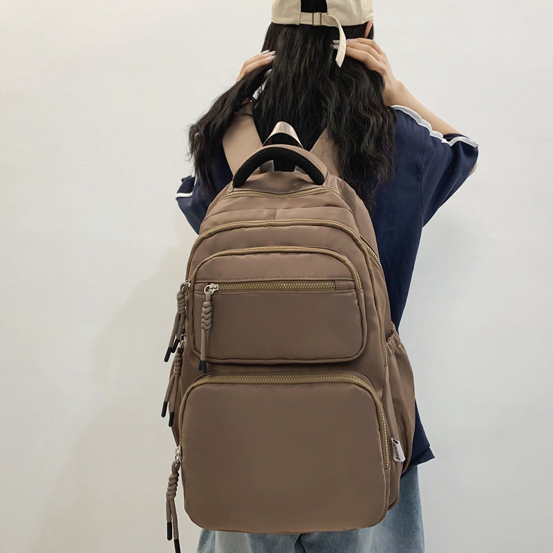 Leisure backpack with multiple compartments and ergonomic carrying system