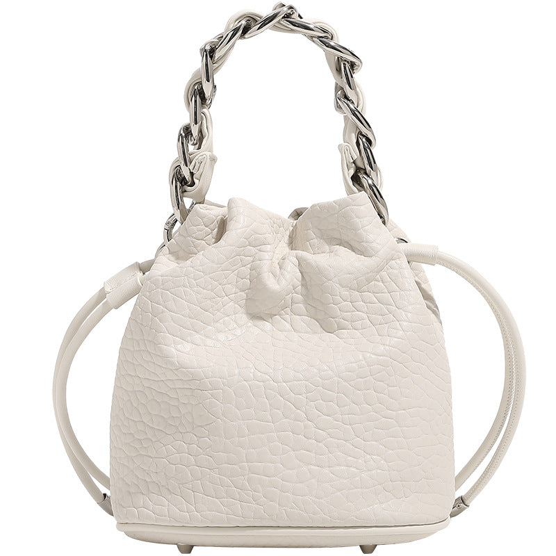 Women's mini backpack bag with elegant chain handle and fine texture