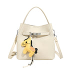 Women’s mini crossbody bag with playful design and cute charm