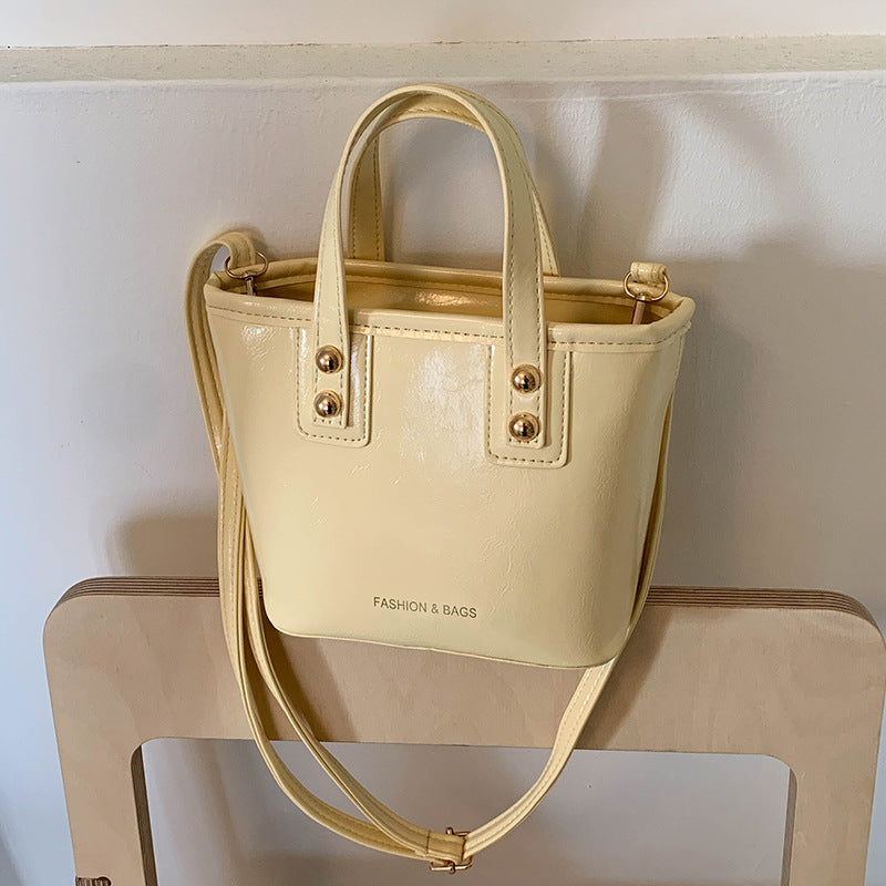 Women's mini bag with elegant structure and practical carrying handle