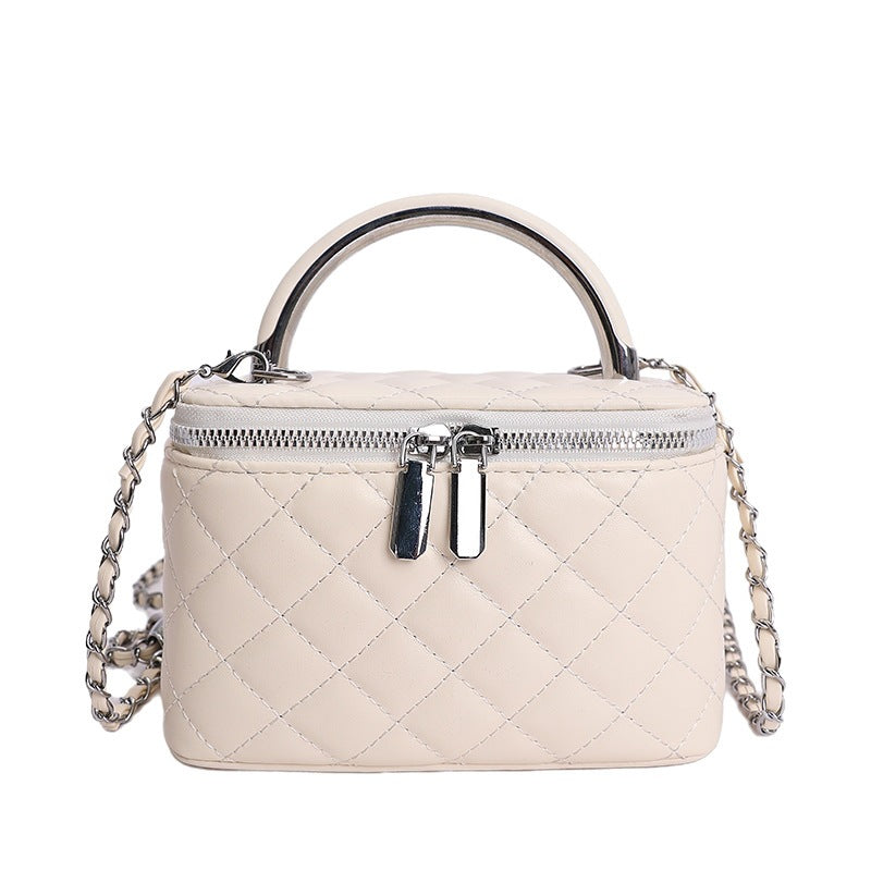 Women's mini handbag with gold chain accent and textured design