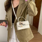 Women's mini crossbody bag with playful charm