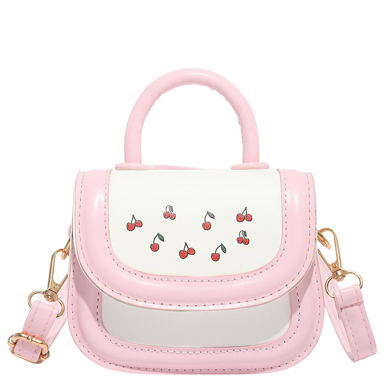 Women's mini handbag with cheerful cherry design and charming pendants