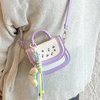 Women's mini handbag with cheerful cherry design and charming pendants