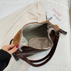Shoulder bag with playful bear motif