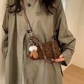 Ladies trendy mini handbag with playful animal charm