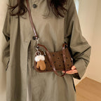 Ladies trendy mini handbag with playful animal charm