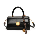 Women's elegant handbag with golden accents