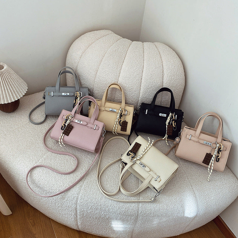 Ladies elegant mini bag with detachable pendant