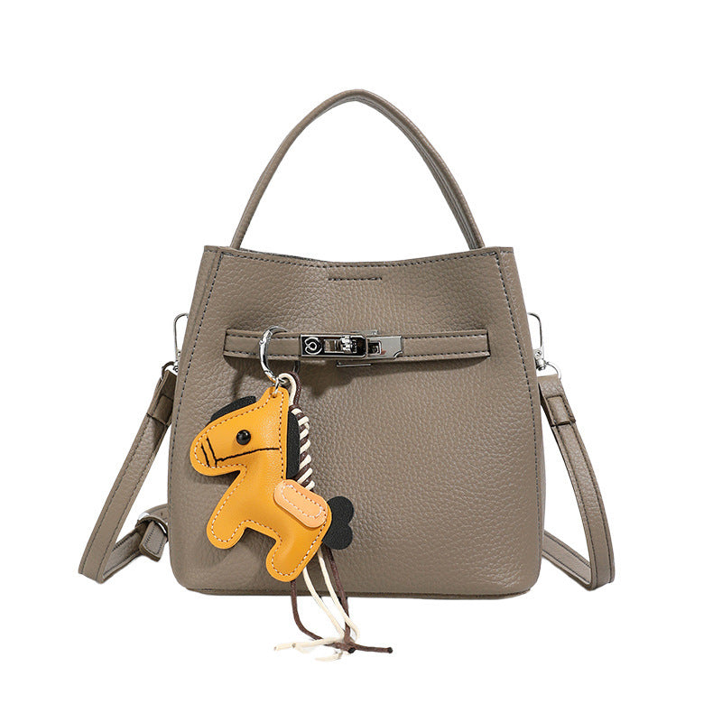Women’s mini crossbody bag with playful design and cute charm