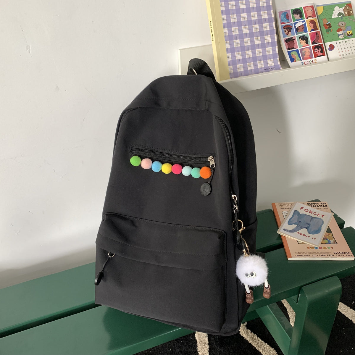 Practical backpack with colorful applications