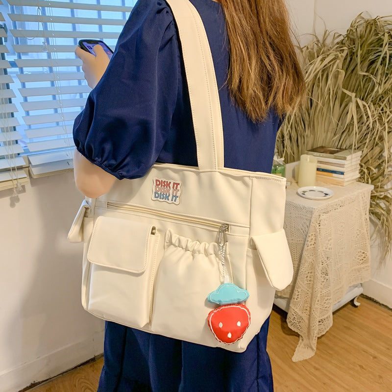 Tote bag with versatile compartments and ergonomic design