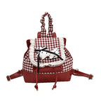 Playful backpack with checkered pattern and animal appliqué