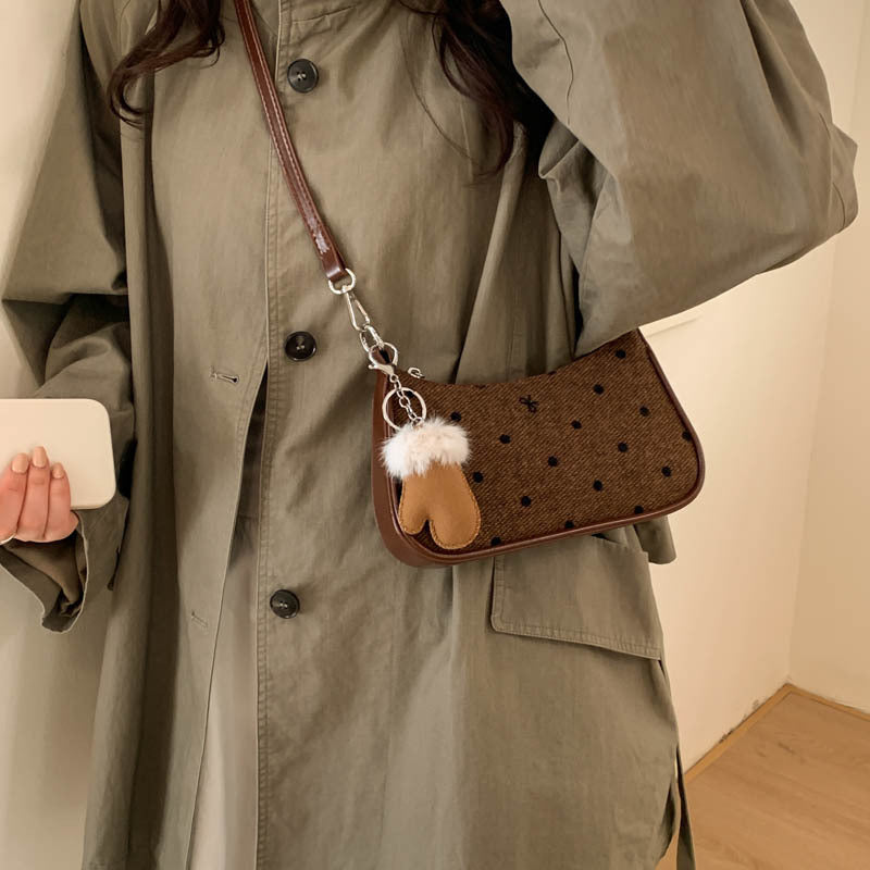 Ladies trendy mini handbag with playful animal charm