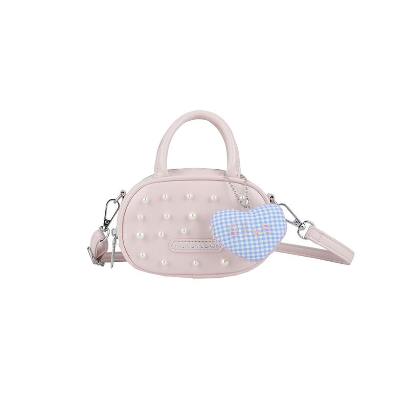 Ladies trendy mini handbag with striking pearl applications