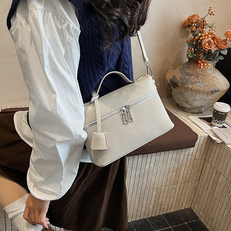 Women's mini shoulder bag with practical compartments