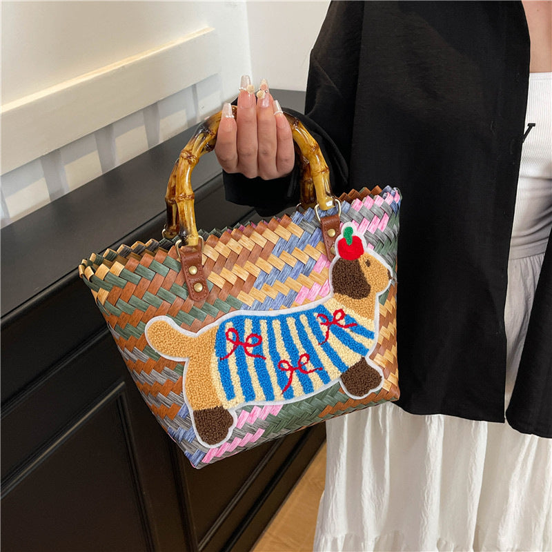 Shoulder bag with playful dog motif