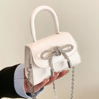 Women’s mini handbag with elegant chain closure