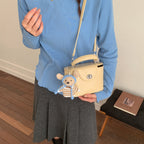 Women’s mini handbag with cute animal pendant