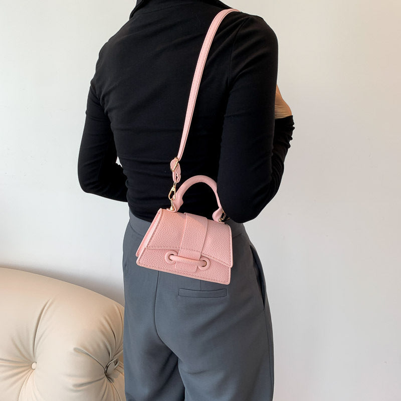 Women's mini handbag with textured leather and stylish closure