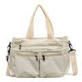 Durable shoulder bag with multiple compartments