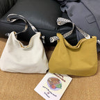 Casual shopper bag with fashionable shoulder strap