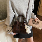 Women’s mini handbag with modern accents and practical interior organizer