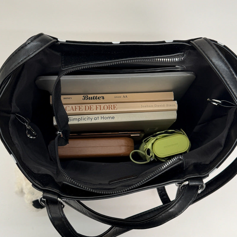 Plush shoulder bag with playful dog motif