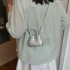 Ladies mini handbag with smooth structure and removable chain strap