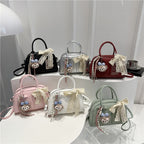 Ladies Mini Handbag with playful animal motif and charming charm