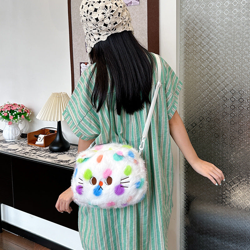 Plush bag with playful cat design