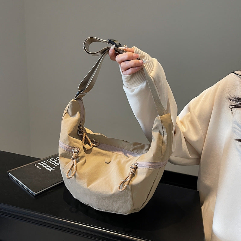 Practical shoulder bag with external zip pockets