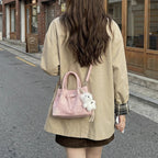 Women’s mini handbag with modern accents and practical interior organizer