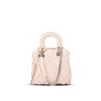 Women’s mini handbag with striking cinched design and pearl accents