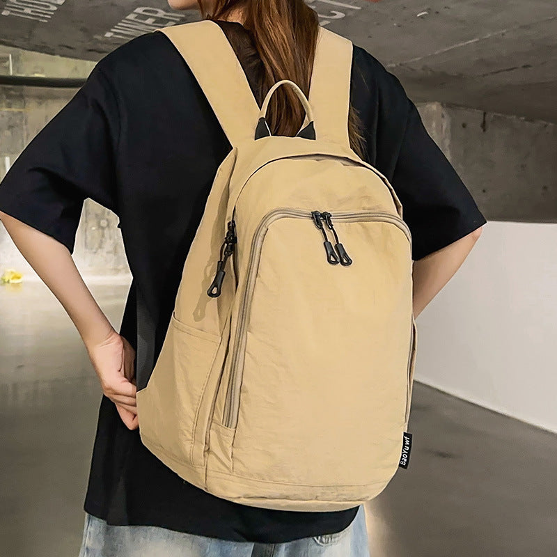City backpack with versatile compartments and breathable carrying system