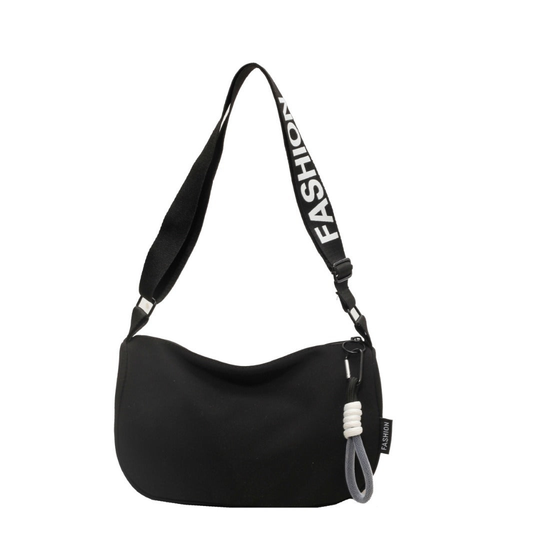 Fashionable shoulder bag with adjustable carrying strap