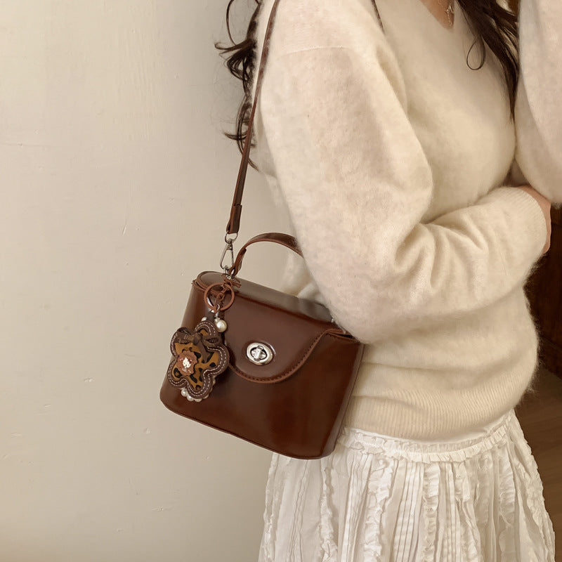 Ladies elegant mini handbag with stylish charm