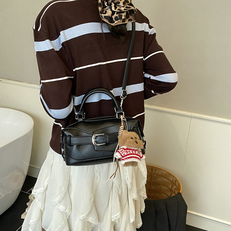 Women's mini handbag with charming animal pendant