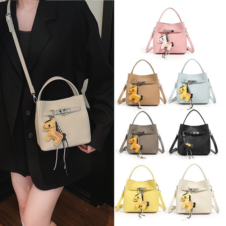 Women’s mini crossbody bag with playful design and cute charm