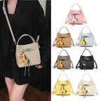 Women’s mini crossbody bag with playful design and cute charm