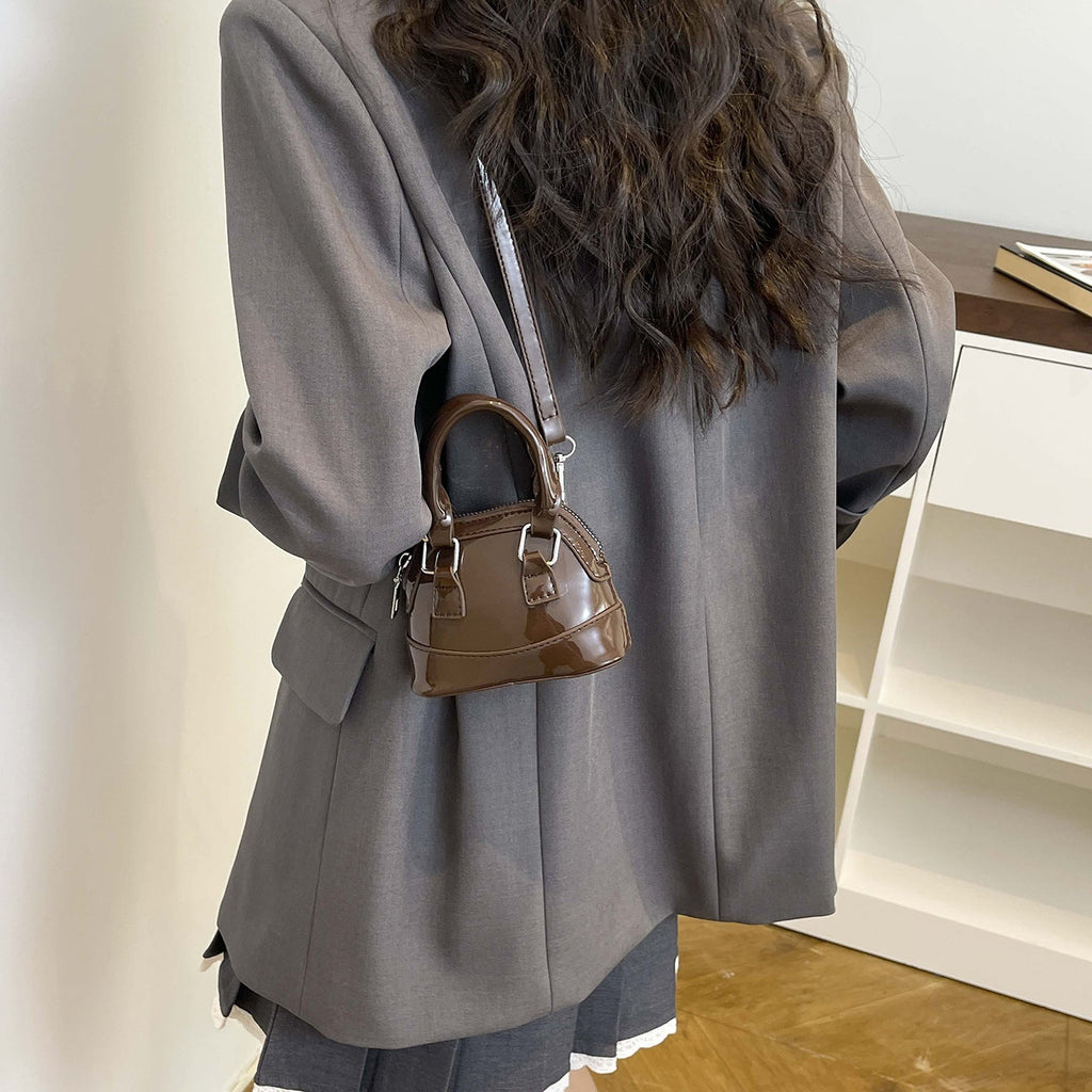 Women's mini handbag with glossy surface and fashionable zipper
