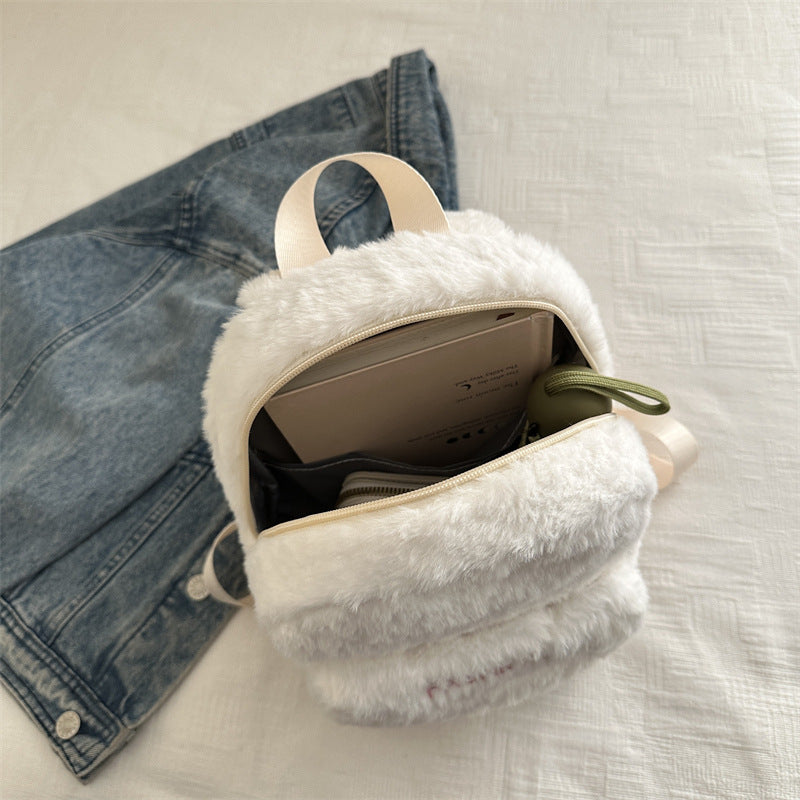 Plush backpack with playful design