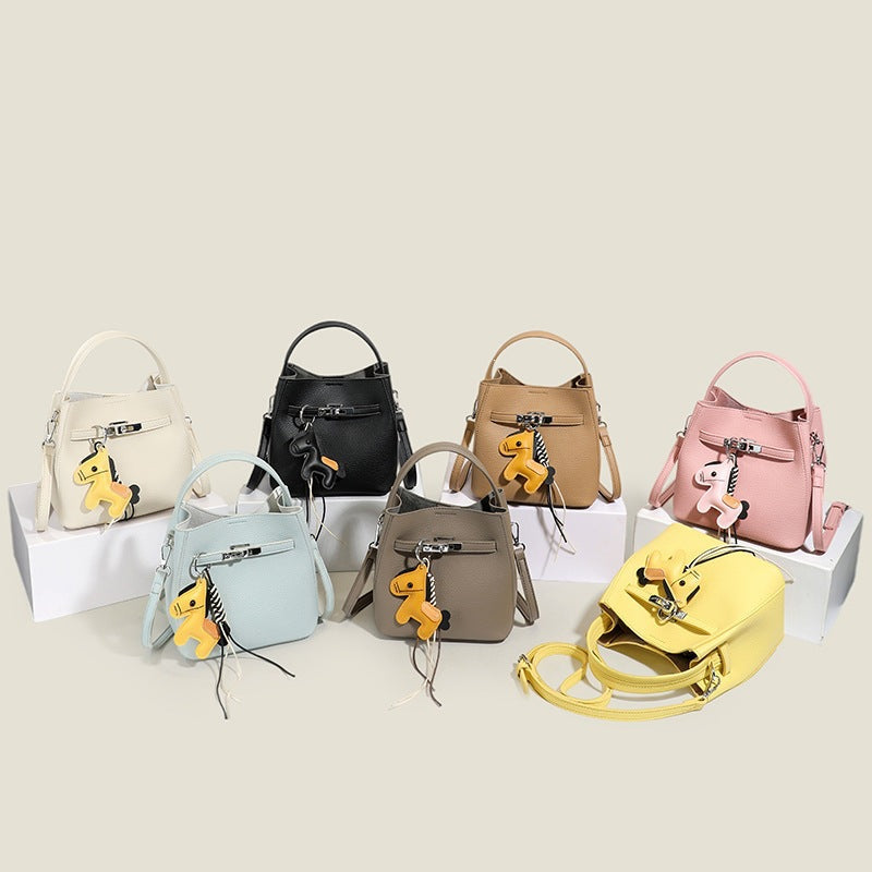 Women’s mini crossbody bag with playful design and cute charm