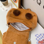 Plush shoulder bag with animal motif and shoulder strap