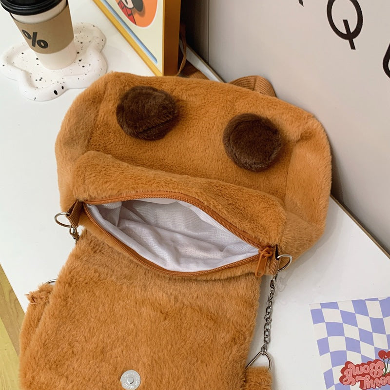 Plush shoulder bag with animal motif and shoulder strap