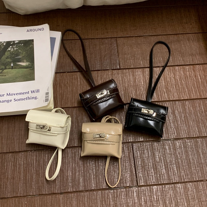 Ladies mini handbag made of high-quality artificial leather with playful closure