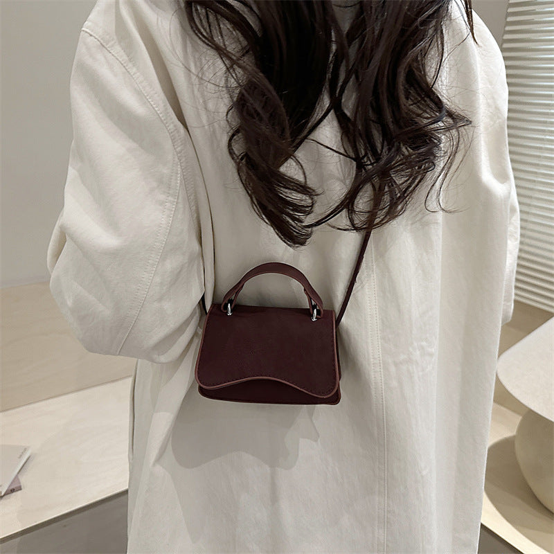 Women's mini handbag with removable carry handle